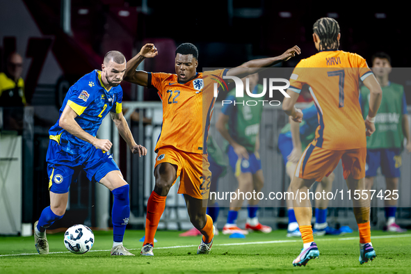 Bosnia and Herzegovina defender Nihad Mujakic and Netherlands defender Denzel Dumfries during the match between the Netherlands and Bosnia a...