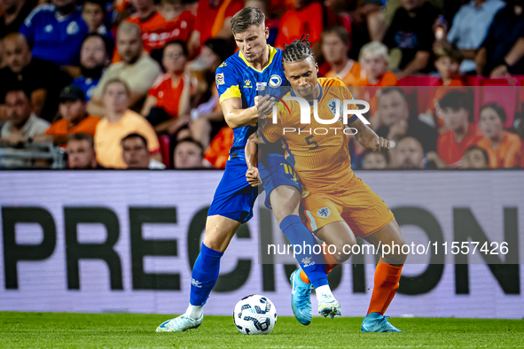 Bosnia and Herzegovina forward Ermedin Demirovic and Netherlands defender Nathan Ake during the match between the Netherlands and Bosnia and...