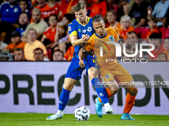 Bosnia and Herzegovina forward Ermedin Demirovic and Netherlands defender Nathan Ake during the match between the Netherlands and Bosnia and...