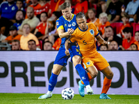 Bosnia and Herzegovina forward Ermedin Demirovic and Netherlands defender Nathan Ake during the match between the Netherlands and Bosnia and...