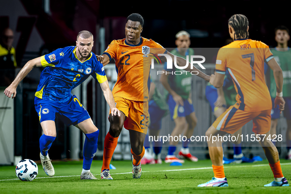 Bosnia and Herzegovina defender Nihad Mujakic and Netherlands defender Denzel Dumfries during the match between the Netherlands and Bosnia a...