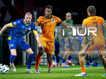 Bosnia and Herzegovina defender Nihad Mujakic and Netherlands defender Denzel Dumfries during the match between the Netherlands and Bosnia a...