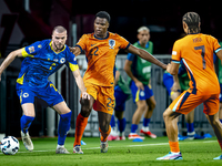 Bosnia and Herzegovina defender Nihad Mujakic and Netherlands defender Denzel Dumfries during the match between the Netherlands and Bosnia a...