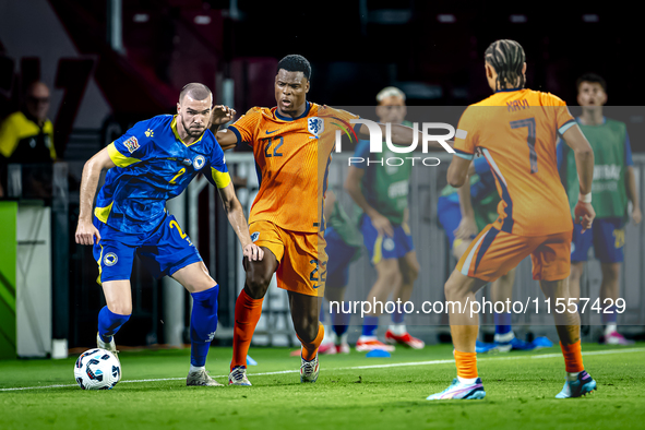 Bosnia and Herzegovina defender Nihad Mujakic and Netherlands defender Denzel Dumfries during the match between the Netherlands and Bosnia a...