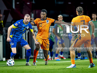 Bosnia and Herzegovina defender Nihad Mujakic and Netherlands defender Denzel Dumfries during the match between the Netherlands and Bosnia a...