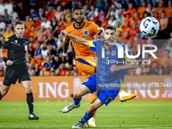 Netherlands forward Cody Gakpo and Bosnia and Herzegovina defender Adrian Leon Barisic during the match between the Netherlands and Bosnia a...