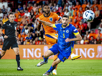 Netherlands forward Cody Gakpo and Bosnia and Herzegovina defender Adrian Leon Barisic during the match between the Netherlands and Bosnia a...