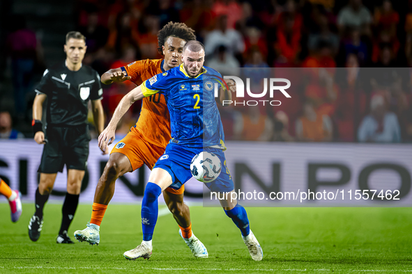 Netherlands forward Joshua Zirkzee and Bosnia and Herzegovina defender Nihad Mujakic during the match between the Netherlands and Bosnia and...