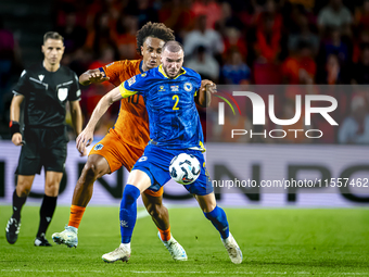 Netherlands forward Joshua Zirkzee and Bosnia and Herzegovina defender Nihad Mujakic during the match between the Netherlands and Bosnia and...