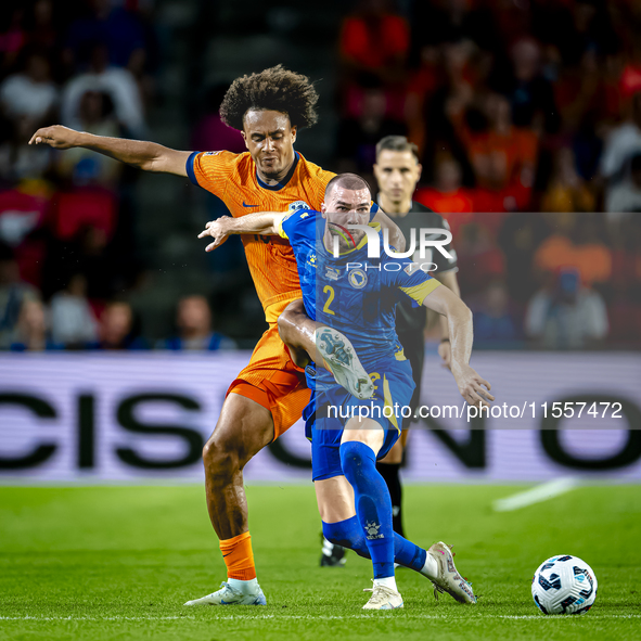 Netherlands forward Joshua Zirkzee and Bosnia and Herzegovina defender Nihad Mujakic during the match between the Netherlands and Bosnia and...