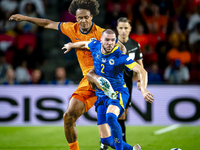 Netherlands forward Joshua Zirkzee and Bosnia and Herzegovina defender Nihad Mujakic during the match between the Netherlands and Bosnia and...