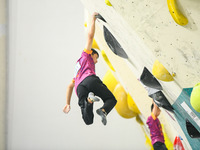 Contestants take part in a rock climbing competition at the indoor climbing gym of Anlong National Mountain Outdoor Sports Demonstration Par...