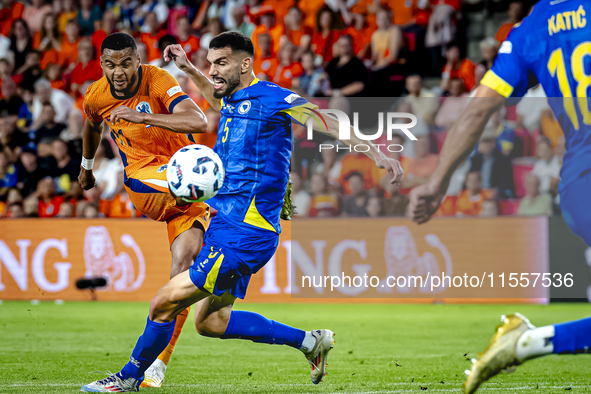 Netherlands forward Cody Gakpo and Bosnia and Herzegovina defender Adrian Leon Barisic during the match between the Netherlands and Bosnia a...