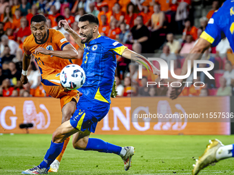 Netherlands forward Cody Gakpo and Bosnia and Herzegovina defender Adrian Leon Barisic during the match between the Netherlands and Bosnia a...