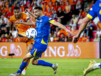 Netherlands forward Cody Gakpo and Bosnia and Herzegovina defender Adrian Leon Barisic during the match between the Netherlands and Bosnia a...