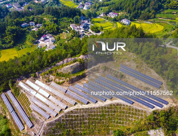 Photovoltaic panels are installed on a barren mountain in Anqing, China, on September 8, 2024. 