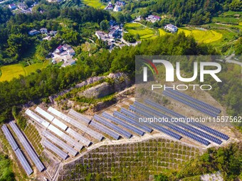 Photovoltaic panels are installed on a barren mountain in Anqing, China, on September 8, 2024. (