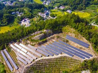 Photovoltaic panels are installed on a barren mountain in Anqing, China, on September 8, 2024. (