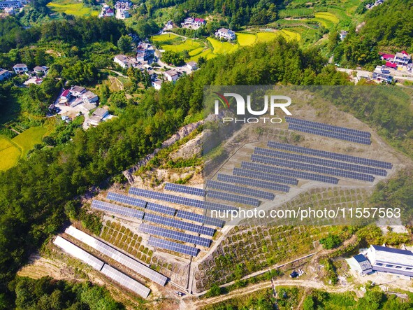 Photovoltaic panels are installed on a barren mountain in Anqing, China, on September 8, 2024. 