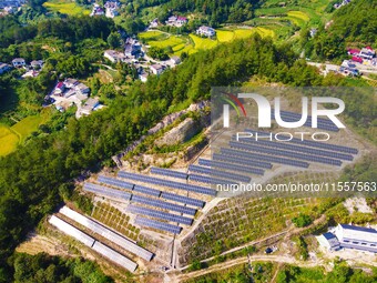 Photovoltaic panels are installed on a barren mountain in Anqing, China, on September 8, 2024. (