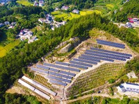 Photovoltaic panels are installed on a barren mountain in Anqing, China, on September 8, 2024. (