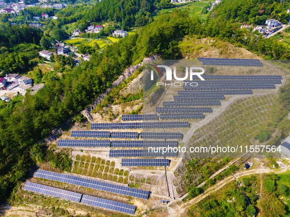 Photovoltaic panels are installed on a barren mountain in Anqing, China, on September 8, 2024. 