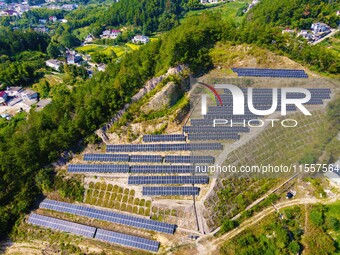 Photovoltaic panels are installed on a barren mountain in Anqing, China, on September 8, 2024. (