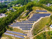 Photovoltaic panels are installed on a barren mountain in Anqing, China, on September 8, 2024. (