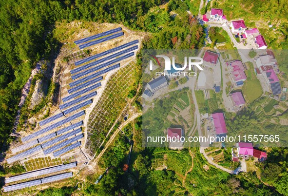 Photovoltaic panels are installed on a barren mountain in Anqing, China, on September 8, 2024. 