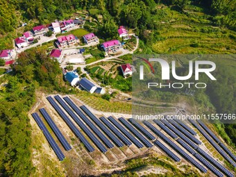 Photovoltaic panels are installed on a barren mountain in Anqing, China, on September 8, 2024. (