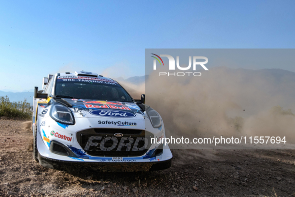 Driver Gregoire Munster and co-driver Louis Louka of the team M-Sport Ford World Rally Team Ford Puma Rally1 Hybrid face the second day of t...