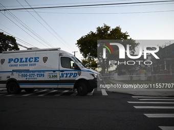 Crime scene investigators place evidence markers at the scene where three people are shot at 132-45 220th Street in Queens, New York, United...