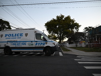 Crime scene investigators place evidence markers at the scene where three people are shot at 132-45 220th Street in Queens, New York, United...