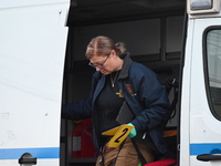 Crime scene investigators place evidence markers at the scene where three people are shot at 132-45 220th Street in Queens, New York, United...