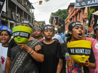 Artisans of Durga Puja and common citizens participate in a protest rally in Kolkata, India, on September 8, 2024, demanding justice for the...