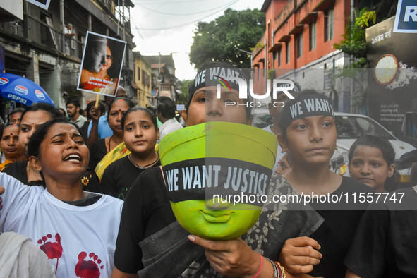 Artisans of Durga Puja and common citizens participate in a protest rally in Kolkata, India, on September 8, 2024, demanding justice for the...