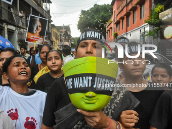 Artisans of Durga Puja and common citizens participate in a protest rally in Kolkata, India, on September 8, 2024, demanding justice for the...