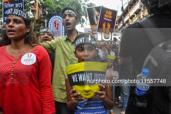 Artisans of Durga Puja and common citizens participate in a protest rally in Kolkata, India, on September 8, 2024, demanding justice for the...