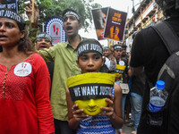 Artisans of Durga Puja and common citizens participate in a protest rally in Kolkata, India, on September 8, 2024, demanding justice for the...