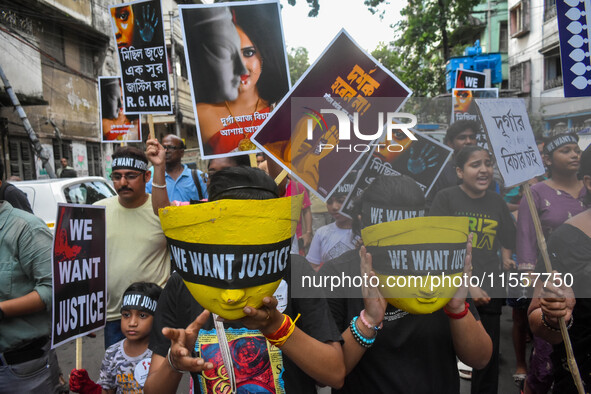 Artisans of Durga Puja and common citizens participate in a protest rally in Kolkata, India, on September 8, 2024, demanding justice for the...