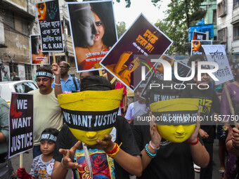 Artisans of Durga Puja and common citizens participate in a protest rally in Kolkata, India, on September 8, 2024, demanding justice for the...