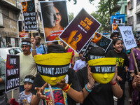 Artisans of Durga Puja and common citizens participate in a protest rally in Kolkata, India, on September 8, 2024, demanding justice for the...