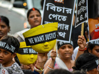 Artisans of Durga Puja and common citizens participate in a protest rally in Kolkata, India, on September 8, 2024, demanding justice for the...