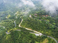 An aerial photo shows a winding rural road in Dingdong township, Congjiang county, in Guizhou province, China, on September 8, 2024. (