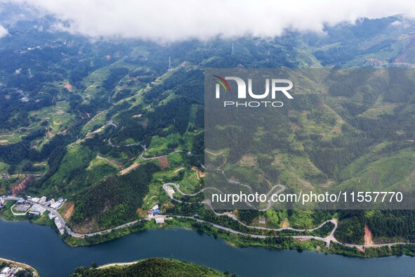 An aerial photo shows a winding rural road in Dingdong township, Congjiang county, in Guizhou province, China, on September 8, 2024. 