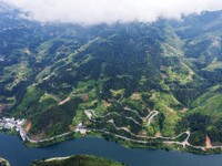 An aerial photo shows a winding rural road in Dingdong township, Congjiang county, in Guizhou province, China, on September 8, 2024. (