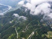 An aerial photo shows a winding rural road in Dingdong township, Congjiang county, in Guizhou province, China, on September 8, 2024. (