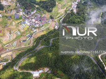 An aerial photo shows a winding rural road in Dingdong township, Congjiang county, in Guizhou province, China, on September 8, 2024. (