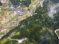 An aerial photo shows a winding rural road in Dingdong township, Congjiang county, in Guizhou province, China, on September 8, 2024. (