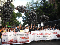 Members of the West Bengal Junior and Senior Doctors' Front march along a street during a protest condemning the rape and murder of a traine...